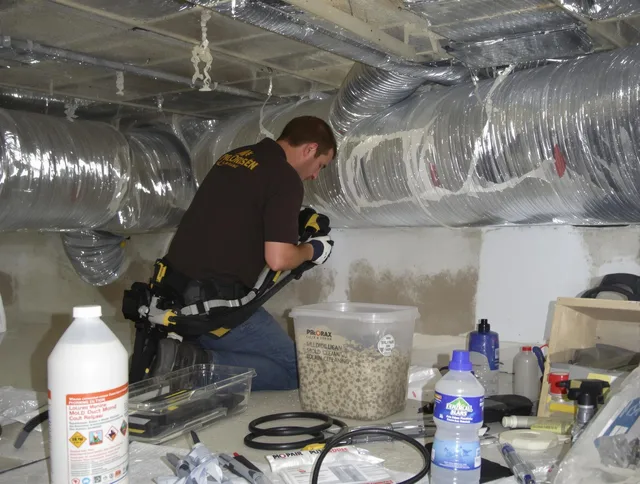 Rehoboth Air Duct Cleaning specialist performing professional mold removal from air ducts in Rehoboth