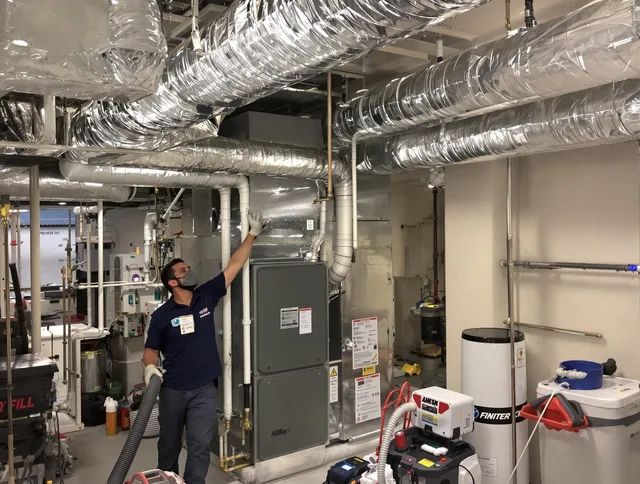 Rehoboth Air Duct Cleaning specialist performing thorough furnace duct cleaning in a Rehoboth residence