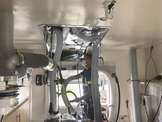 Rehoboth Air Duct Cleaning specialist performing precise mobile home duct cleaning in Rehoboth