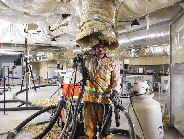 Professional vacuum insulation removal by Rehoboth Air Duct Cleaning expert in Rehoboth